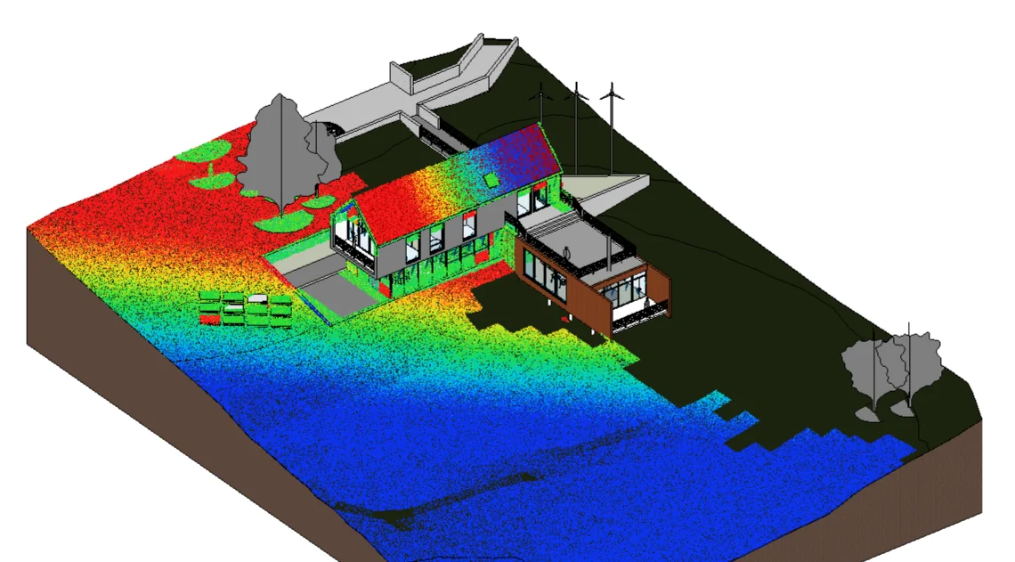 The same Revit view with the deviation heat map: the compared points are inserted as a point cloud coloured from blue through green to red across the site and the roof.